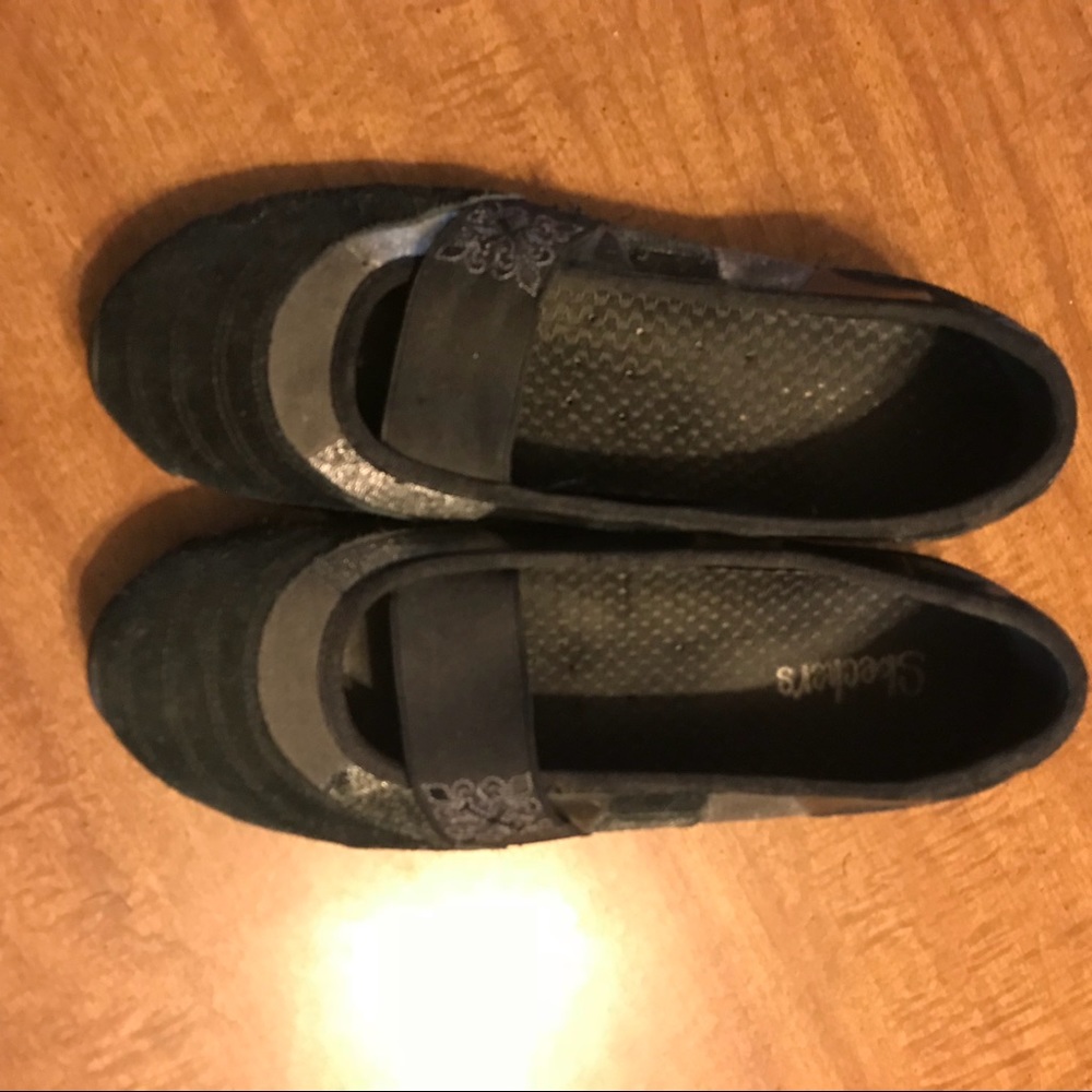 Black suede Skechers